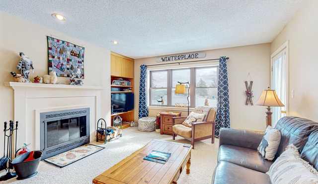 Ski-in/out condo with mountain views, fireplace, pool, & hot tub