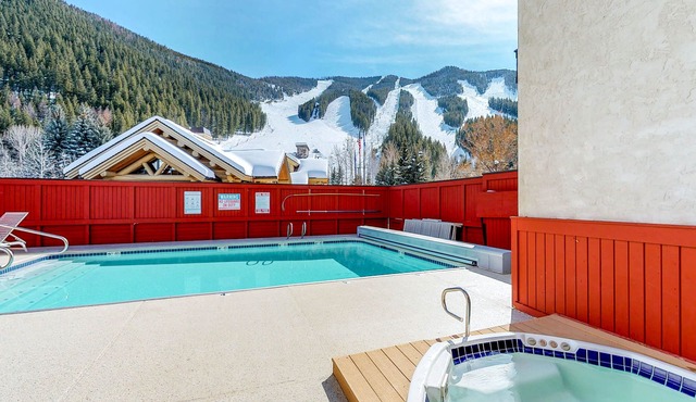 Ski-in/ski-out alpine condo with hot tub, sauna, seasonal pool & views