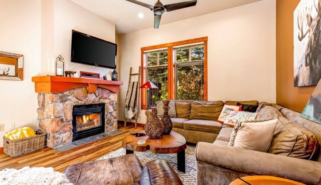 Ski-in/ski-out condo with a deck, ski views & a shared pool and hot tub