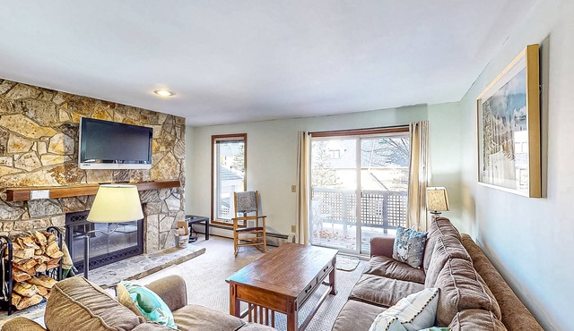 Ski-in/ski-out condo with deck, wood-burning fireplace, & community amenities