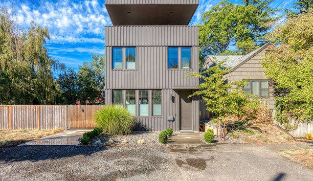 Sleek, modern home with enclosed yard, balcony, patio, WiFi, AC, & W/D