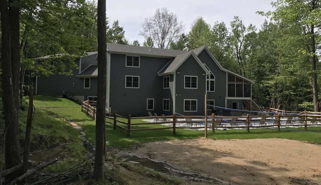 Sleeps 34! new home on 17 acres with pond, pool, volleyball court, trails