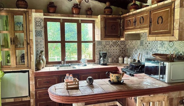 Slim's cabin with stream on the banks of Orizaba
