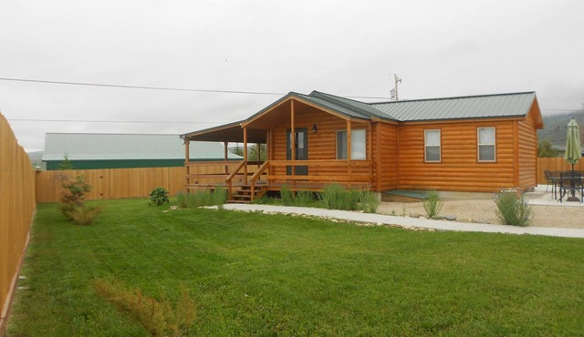 Small House At The Foot Of The Mountains