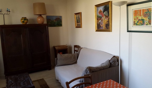 Small house between village and river in a park