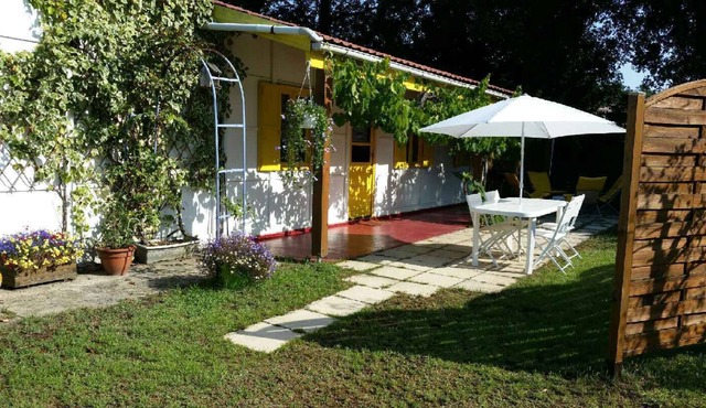 Small house in park with large pool