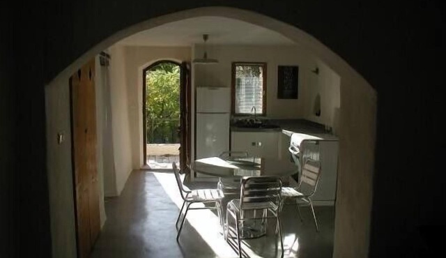 Small House Perched on a Rocky Peak