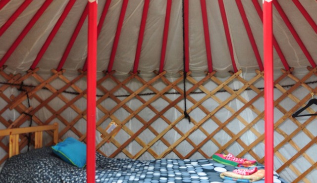 Small red yurt at Cabot Shores Wilderness Resort