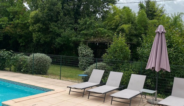 Small stone house with swimming pool and garden