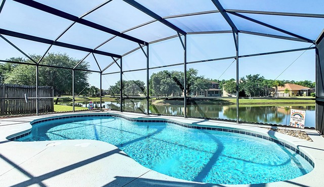 Smiling Disney Oasis heated pool home in Kissimmee with Game room.