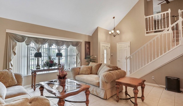 Snowbird-friendly elegant home with waterfront location, pool, grill, fireplace