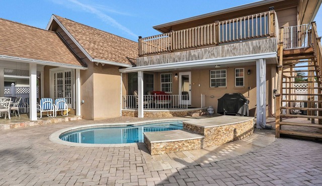 Snowbird friendly elegant home with waterfront location pool grill fireplace