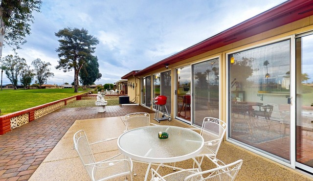 Snowbird-friendly golf-front home with pool, hot tub, grill, smart TVs, W/D, AC
