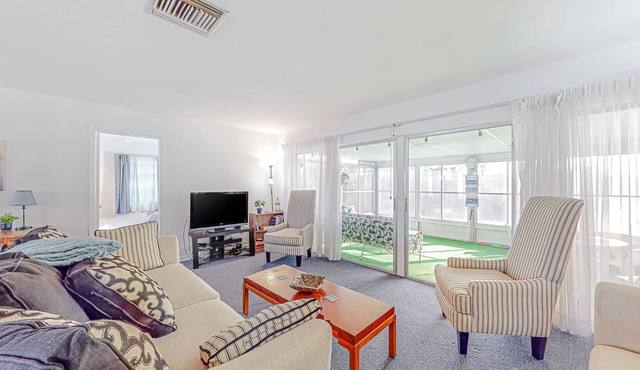 Snowbird-friendly waterfront home with water views, screened porch, streaming
