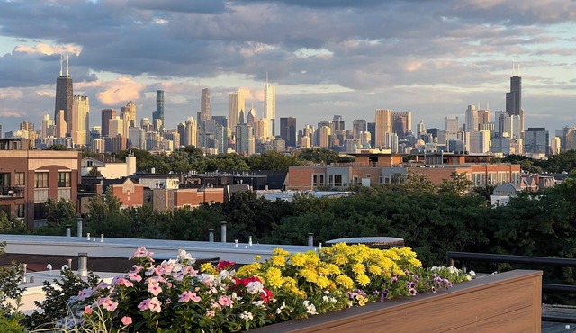 Soaring ceilings, city views and private rooftop deck!
