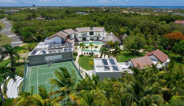 Soaring Circular Home in Paradise with Multiple-Sports Court, Gym & Home Theater