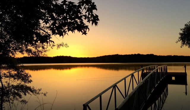 Solar powered cottage at lake, with dock, on private 300 acre timber preserve