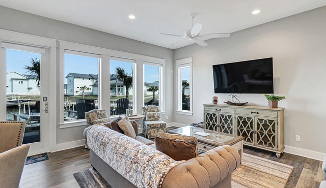 Sophisticated canal-view villa with pool, vast fishing pier, deck & washer/dryer