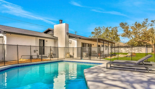 Sophisticated dog-friendly home with pool, large enclosed yard, washer/dryer, AC