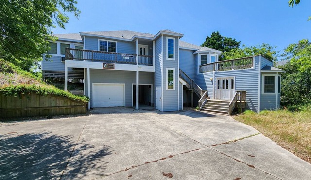 SOUND BARRIER - Spectacular sunsets await your arrival at this 4 BR Soundfront Home