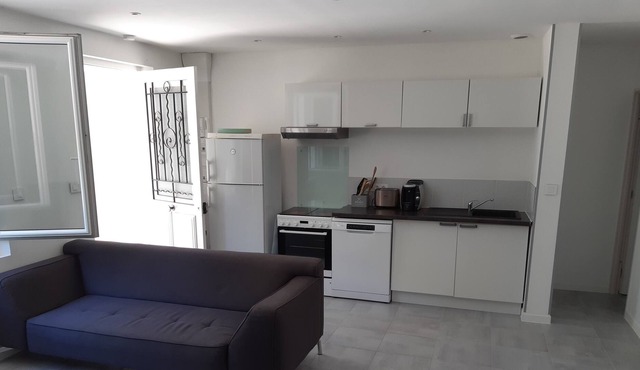 South-facing 2-bedroom apartment near the center of the village