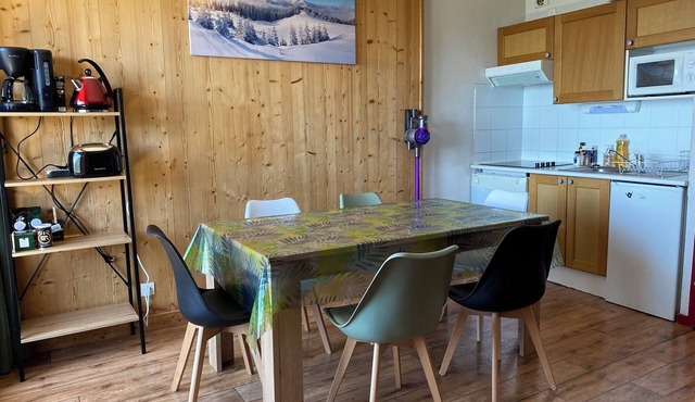 South-facing, large living room, mountain views and private covered parking.