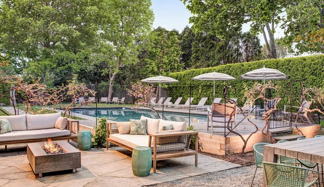 Southampton estate with oversized pool, chefs kitchen, vast lawn,.