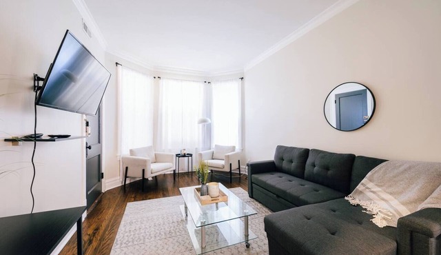 Spacious 3-bedroom retreat in West Logan with modern amenities, perfect for families looking to relax and explore vibrant Logan Square.