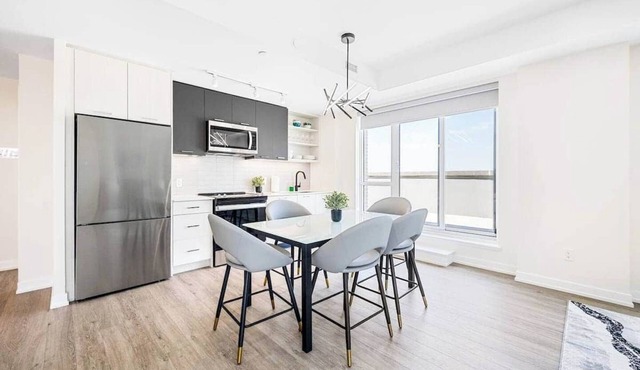 Spacious 3-Bedroom Suite in Toronto with Air Conditioning and Full Kitchen