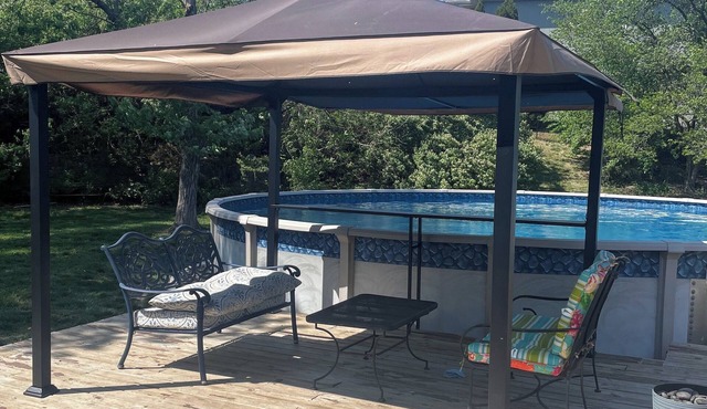 Spacious 3-bedroom home in Kansas City with pool on private large lot.