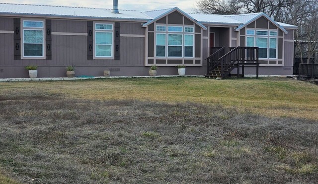 Spacious 4-bedroom Foremans ranch house on a 150 acre ranch with a deck/full gym