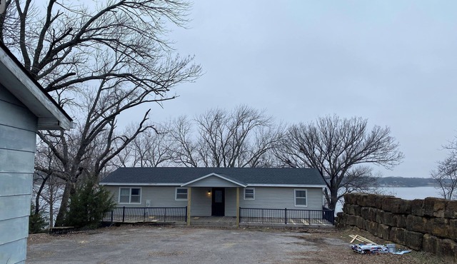 Spacious 4-bedroom house steps away from the water at beautiful Fort Scott Lake.