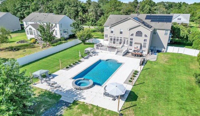 spacious 5,500 square foot home located on one acre property, is fully fenced and Great for larger groups, comfortably accommodating 24 total guests.