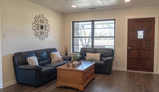 Spacious 5-bedroom, 2-bath retreat that comfortably hosts up to 12 guests. Unwind along Dry Elm Creek, soak in the wide-open skies, and explore nearby Muenster—home to charming local dining, 4R Ranch Vineyards, and Turtle Hill Golf Course.