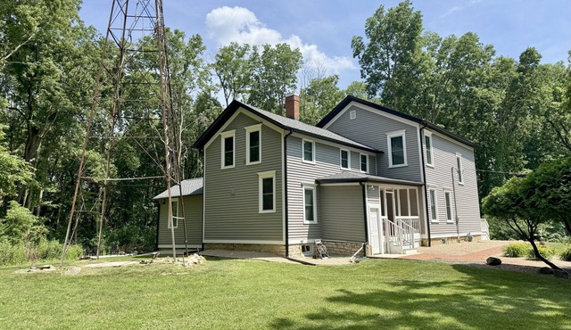 Spacious 5-bedroom farmhouse in charming Oswego with private woods