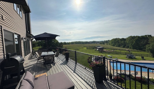 Spacious 5-bedroom house sleeps 14 with pool, hot tub, sauna and more!