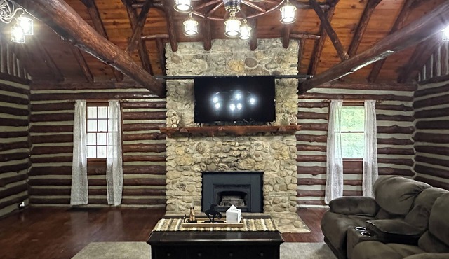 Spacious 5-bedroom log cabin home with 2 ponds and 50 acres just outside Moberly