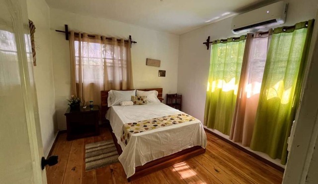 Spacious 6-bedroom villa in Tranquil Monseñor Nouel with AC