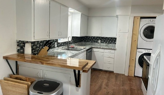 Spacious 6-bedroom, 2 kitchens, 2 living, 2 dining, 2 laundry. Bring the crew