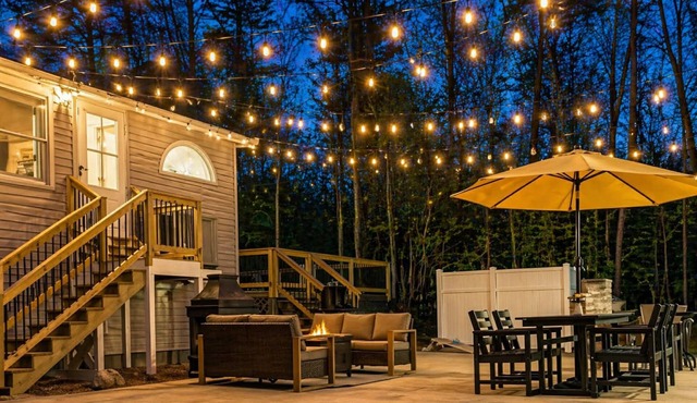 Spacious 9-bedroom waterfront retreat on over 2 private acres with above-ground pool, firepit, gazebo right on Shenandoah River, Theater Room, and detached garage with second kitchen and pool table.