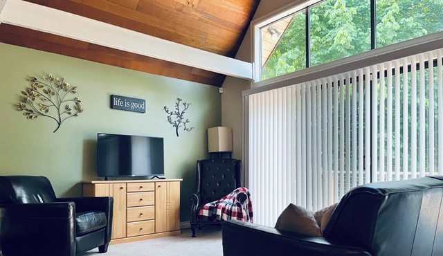 Spacious A-frame backed by thick forest