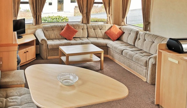 Spacious and comfortable 12ft-wide caravan with one double and two twin.