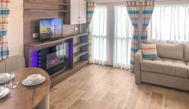 Spacious and comfortable 12ft-wide caravan with one double and two twin.