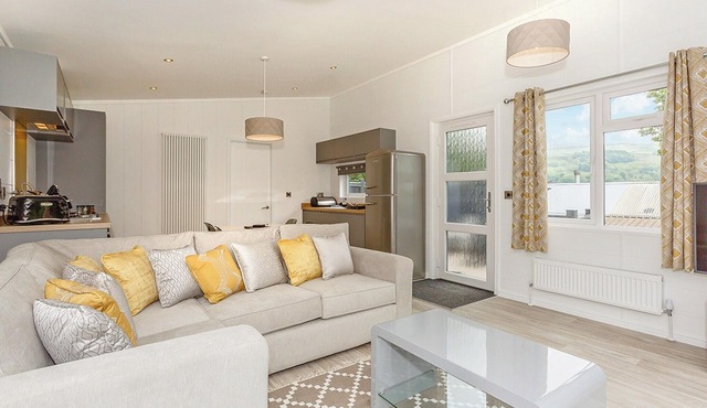 Spacious and contemporary lodge with one double with en suite shower and one twin.