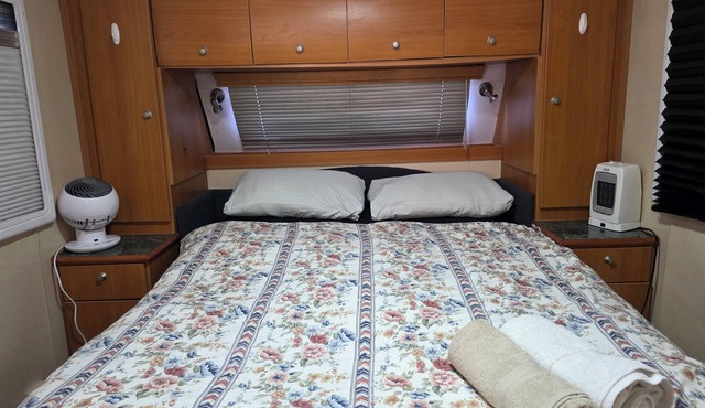 Spacious and cozy fully air-conditioned caravan parked undercover
