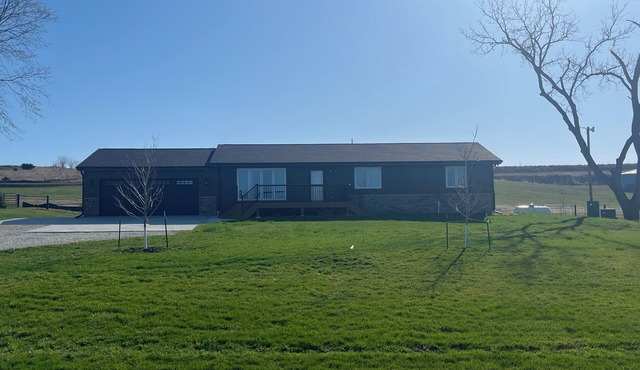 Spacious and cozy 4-bedroom house in rural Iowa with inground backyard pool.