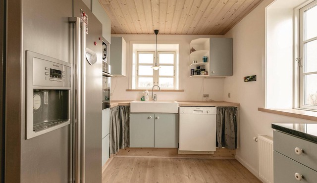 Spacious and modernized vacation home with two floors and sea view.