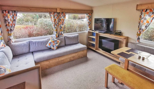 Spacious and well presented 12ft wide caravan with one double and two twin.