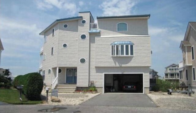 Spacious bayfront home in Avalon Manor with spectacular 360 degree views of the wetlands and inlet from the roof top deck.