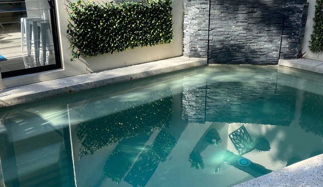 SPACIOUS BEACH HOUSE in beautiful Dicky Beach with private pool.